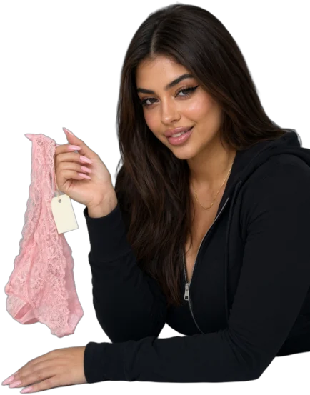 Illustration: a smiling woman with long dark hair in a black hoodie and black trousers, lying on her stomach and holding up pink lace panties with a paper price tag reading $50