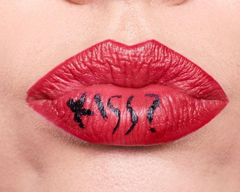 a woman's mouth with red lipstick