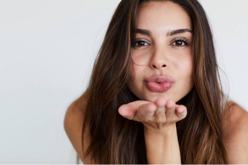 Woman blowing kiss